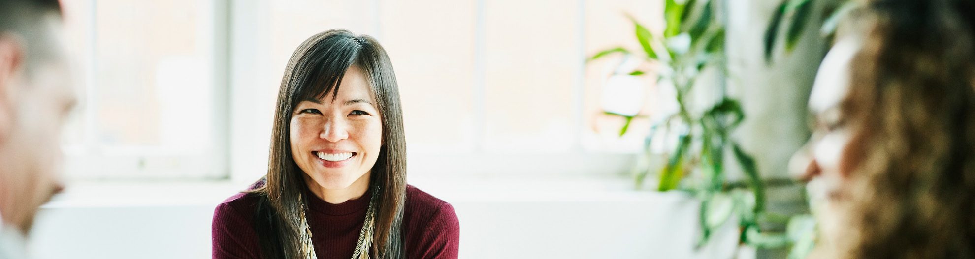 Smiling Businesswoman Meeting with Clients